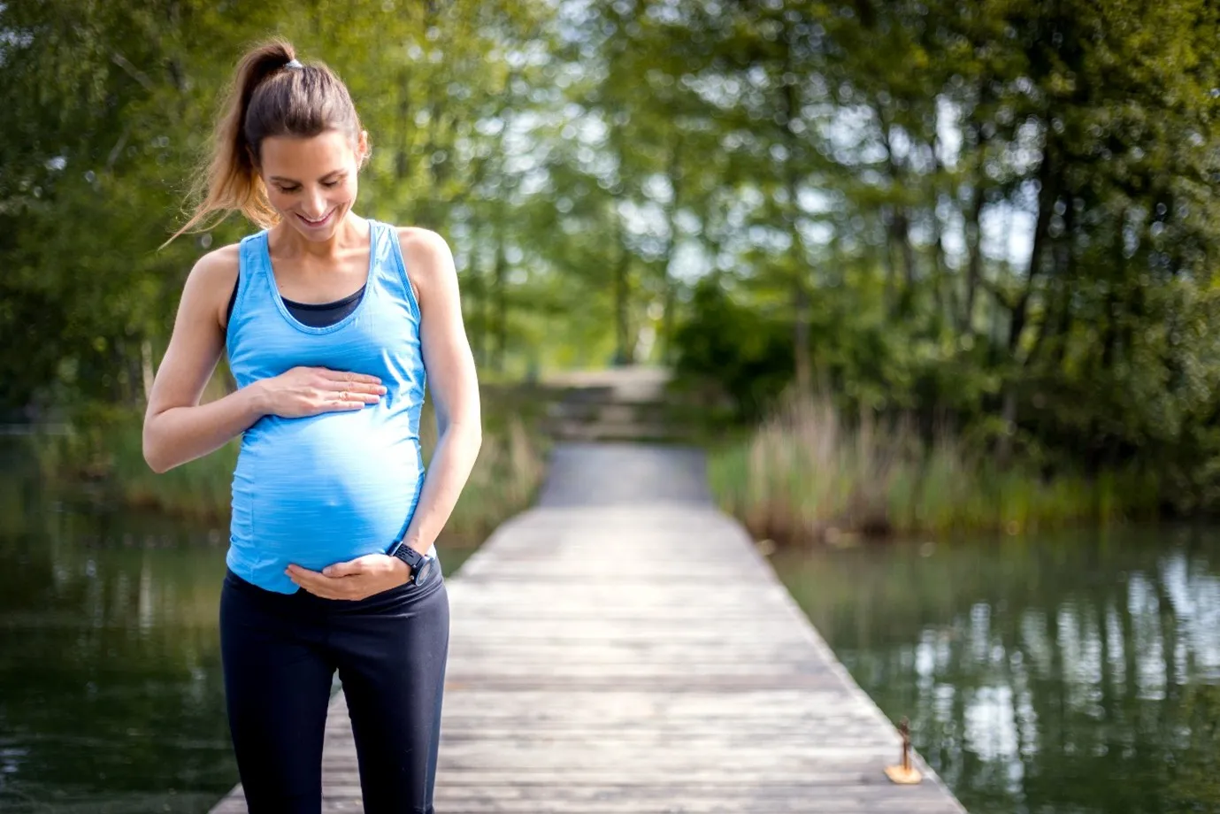 Pregnant Woman Exercising Outdoors in the Second Trimester